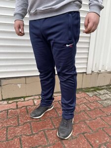 Спортивні штани утеплені на флісі трикотажні великих розмірів із широкою штаниною на високий зріст NIKE