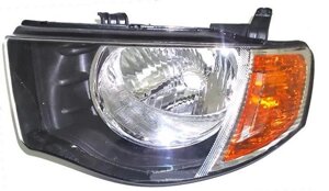 Фара ліва Mitsubishi L200 IV c 2005 - 2015, механ., Жовтий поворотник, подвійна кабіна, (FPS fp590)