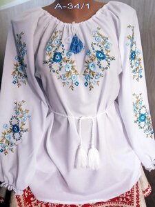 Святкова шифонова вишита жіноча блузка вишиванка з блакитними квітами вишита сорочка вишиванка