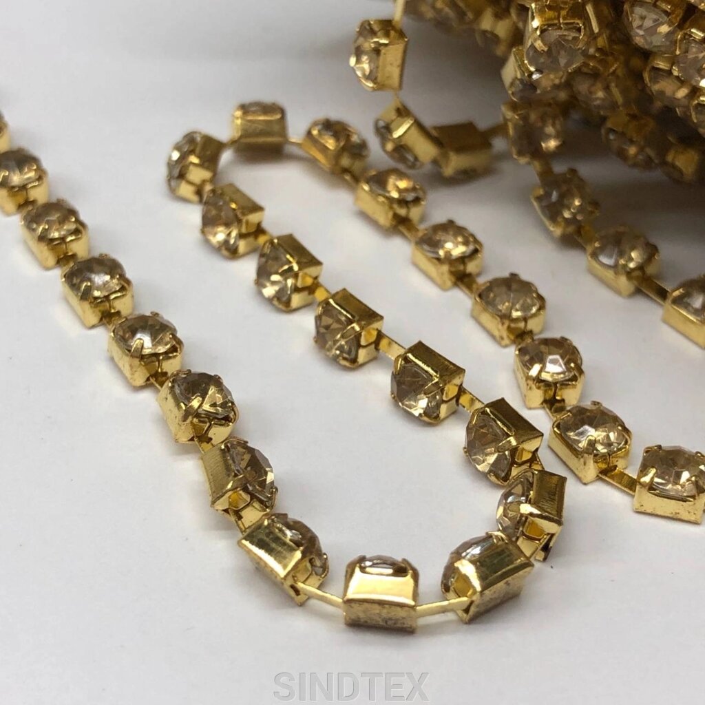 1м - Стразовий ланцюг SS 12 (3 мм) Акриловий золотий кристал у золоті від компанії SINDTEX - фото 1