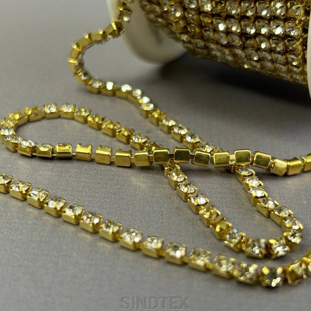 1м - Стразовий ланцюг SS12 (3 мм) Кристал у золоті від компанії SINDTEX - фото 1