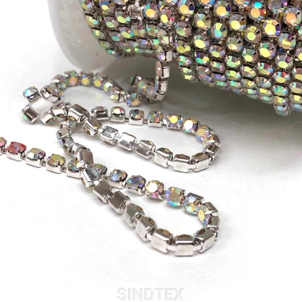 1м - Стразовий ланцюг SS16 (4мм), Кристал з покриттям АВ у сріблі від компанії SINDTEX - фото 1