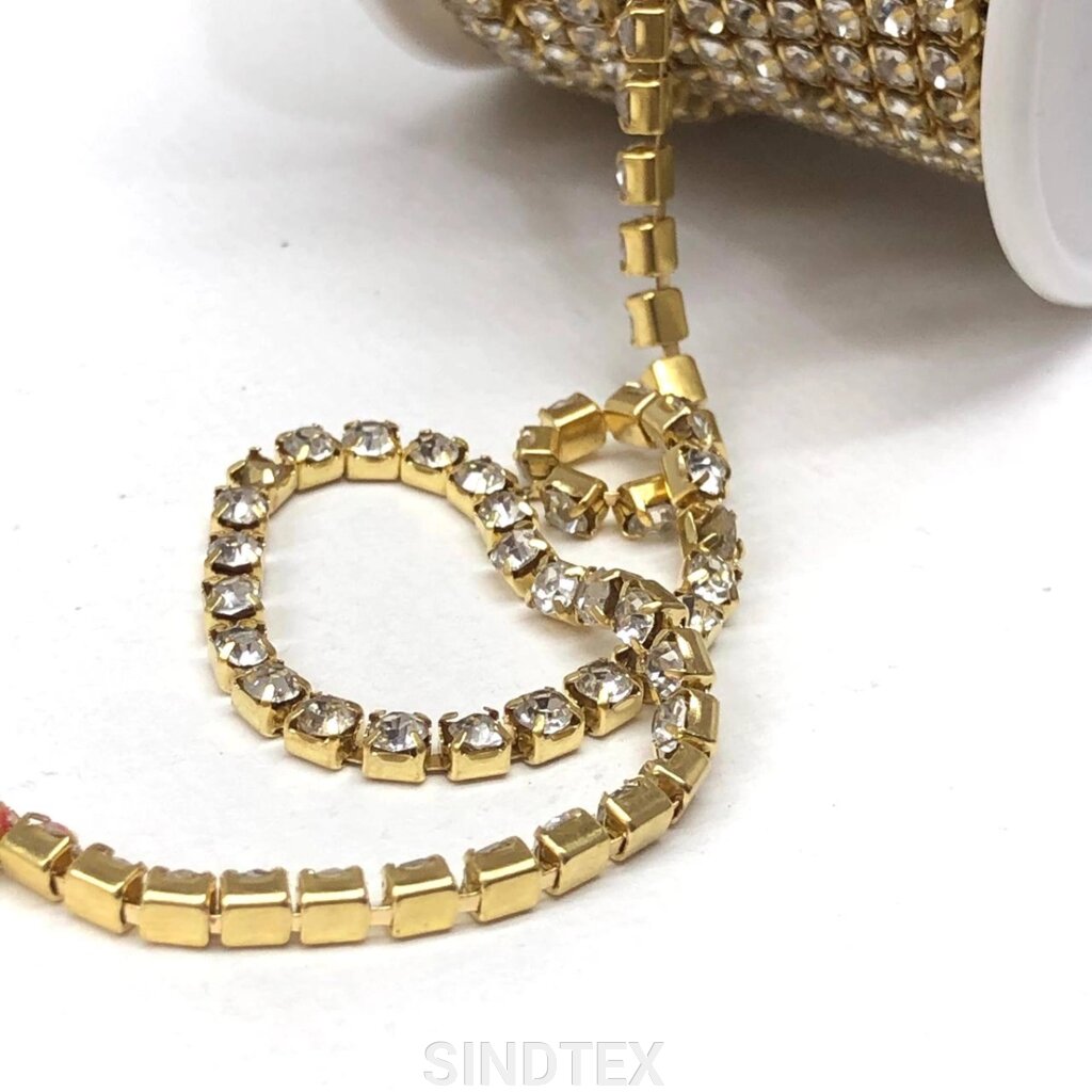1м - Стразовий ланцюг SS8 (3мм), Кристал у золоті від компанії SINDTEX - фото 1
