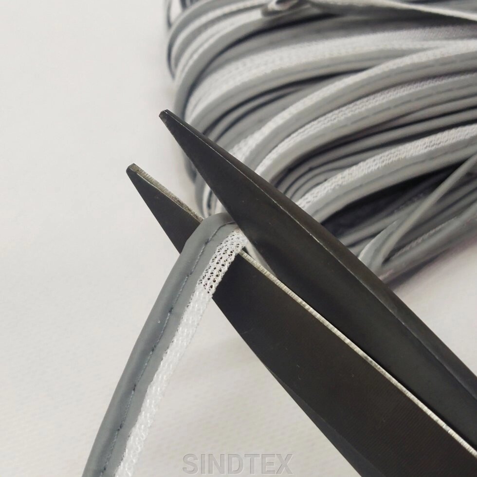 НА ВІДРІЗ кратно 1 м., стрічка кант вшивний світловідбівний сірий від компанії SINDTEX - фото 1