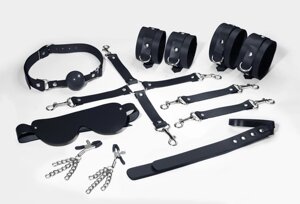 Набір Feral Feelings BDSM Kit 7 Black, наручники, поножі, коннектор, маска, паддл, кляп, затискачі в Дніпропетровській області от компании Интернет магазин Персик