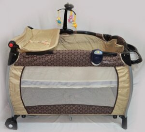 Дитячий манеж-ліжко з пеленатором SIGMA F-R-W прямокутний з ігровою каруселлю / бежевий