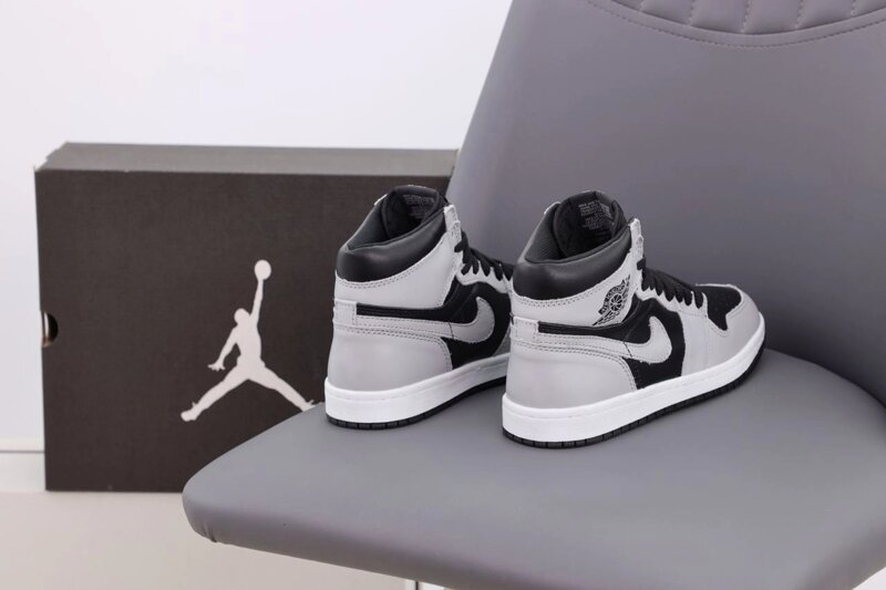 Black and grey hot sale jordan retro 1