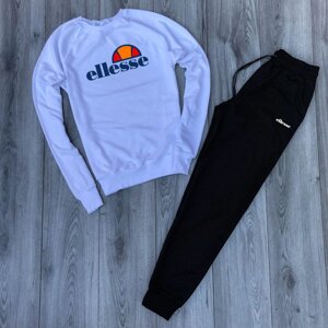 Чоловік спортивний костюм білий реглан з принтом "Ellesse" і чорні штани з принтом "Ellesse"