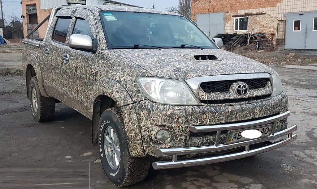 Захист переднього бампера (подвійна нержавіюча труба - подвійний ус) Toyota Hilux (04-15) від компанії AUTOAS - фото 1