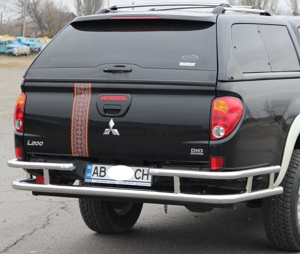 Захист заднього бампера (подвійна нержавіюча труба - подвійний вус) Mitsubishi L-200 Triton (2006-2015) від компанії AUTOAS - фото 1