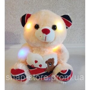 М'яка іграшка ведмедик Тедді, що світиться, 25 см з серцем зі світловими і звуковими ефектами. Кольори: Помаранчевий,