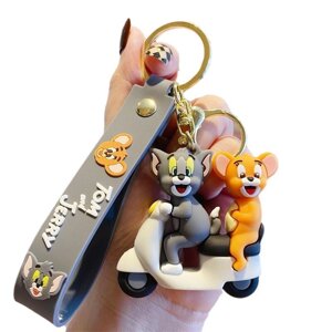 Мультяшний брелок із котом Томом і мишеням Джеррі у кумедній сцені