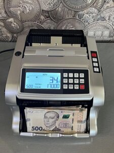 Лічильник банкнот, рахівниця з детектором валюти.
