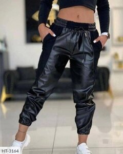 Стильні жіночі штани джоггери комбіновані з еко шкіри та трикотажу з кишенями ефектні розміри 50-60 58/60