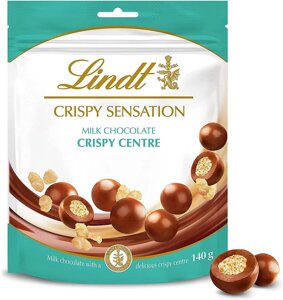 Шоколадні кульки Lindt CRISPY SENSATION Milk Chocolate Crispy Centre Pouch 140г