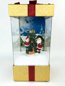 Новорічний ліхтар зі снігом і Дідом Морозом жовтий