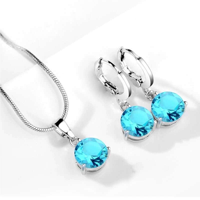Комплект прикрас жіночий сережки, ланцюжок і кулон з блакитними камінням код 1015 від компанії Shock km ua - фото 1