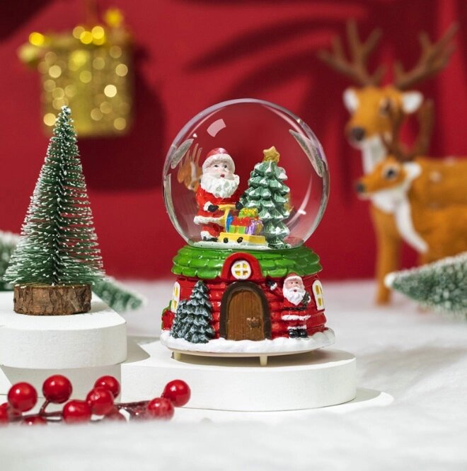 Куля новорічна декоративна з підсвіткою з музикою та зі автоснігом Дід Мороз з подарунками 13995 16х11 см від компанії Shock km ua - фото 1