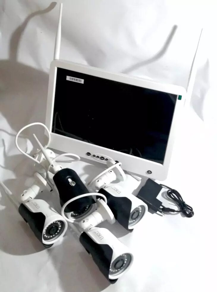 Комплект системи відеоспостереження UKC DVR KIT LCD 13" 13" 1304 WiFi 4ch від компанії Опт, роздріб інтернет магазин Familyshop - фото 1